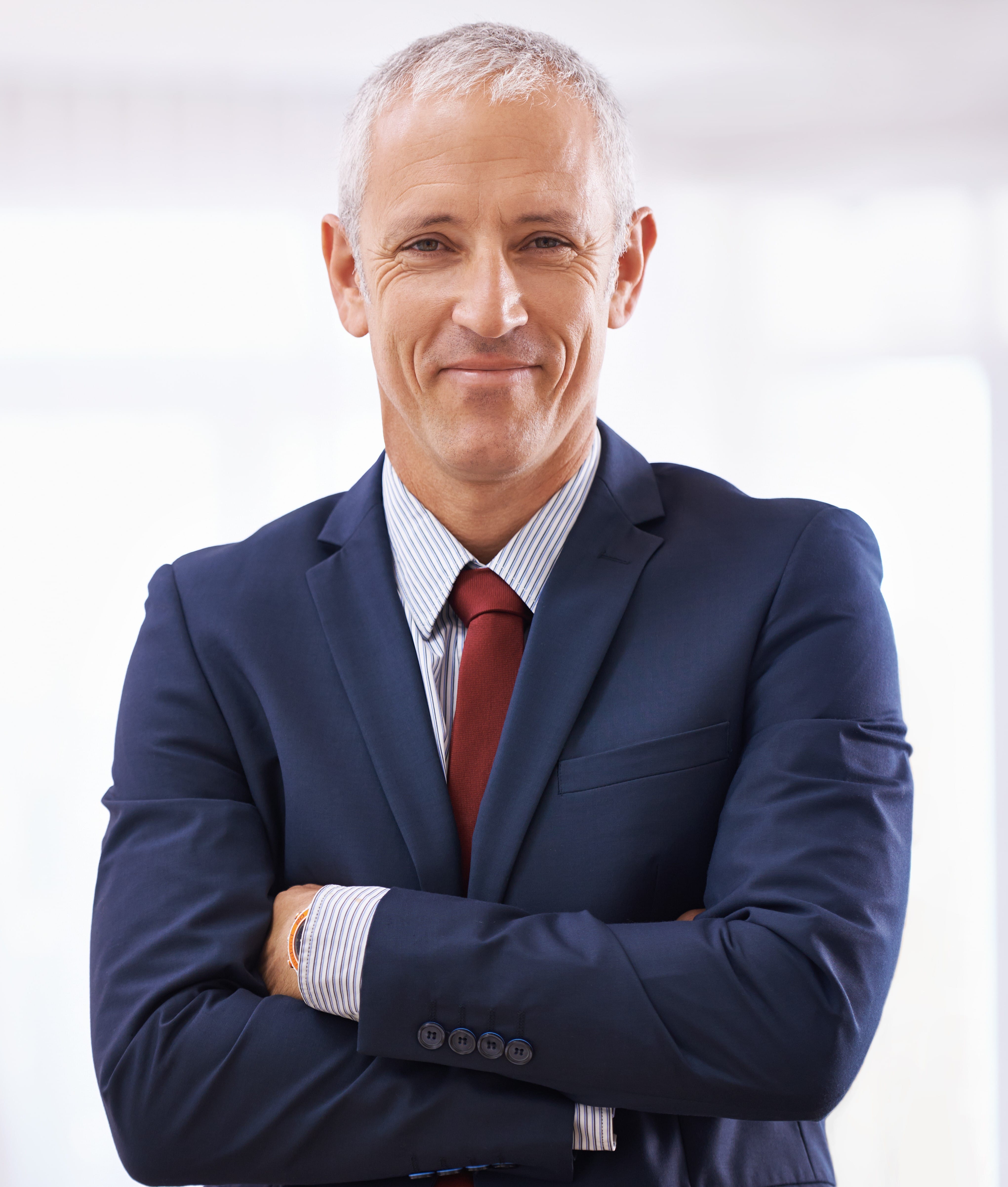 Headshot of a seasoned male executive, showcasing a distinguished leader known for making impactful contributions within their field