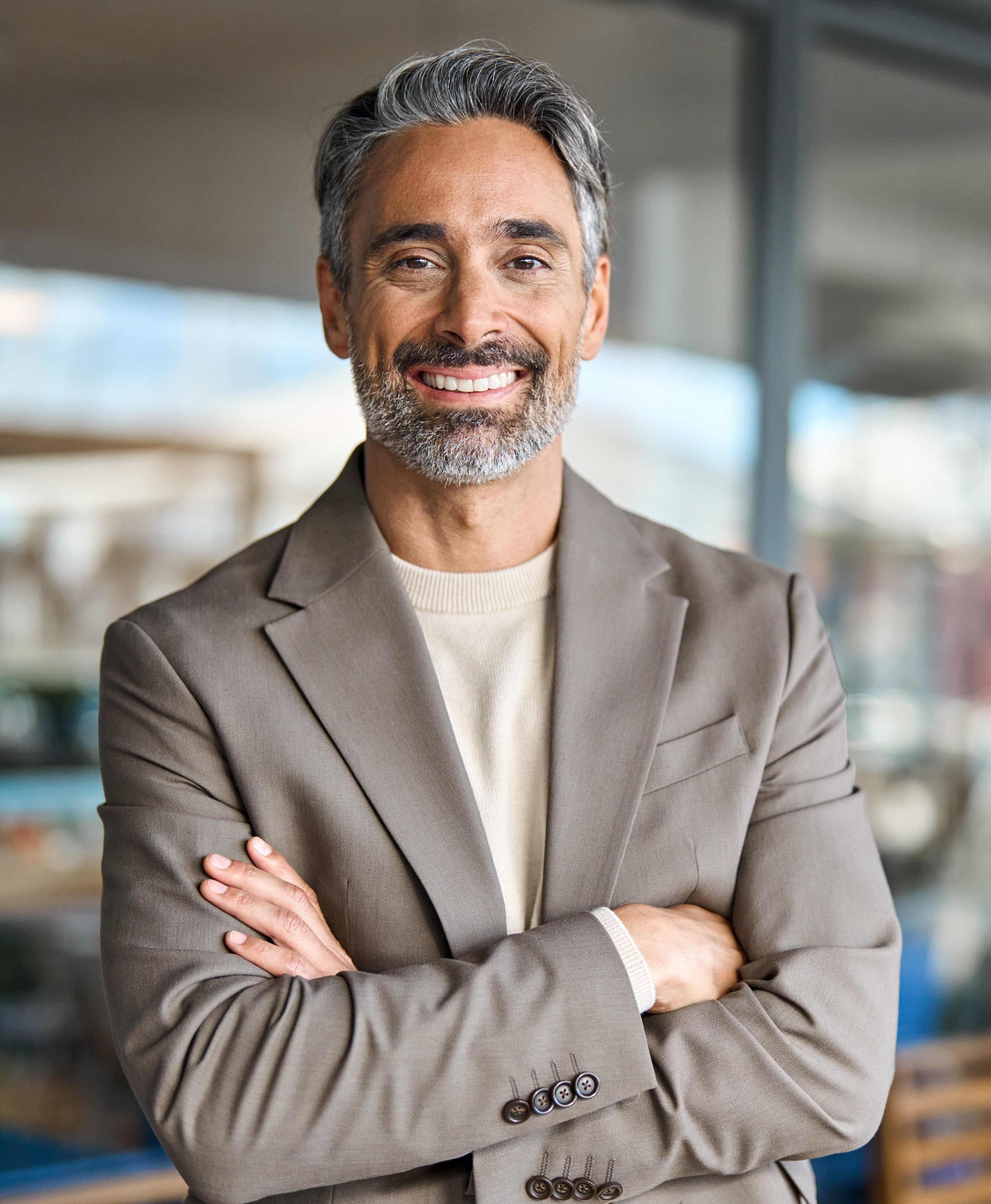 Headshot of a distinguished male executive with a Middle Eastern background, exemplifying leadership that transcends cultural boundaries and promotes diversity